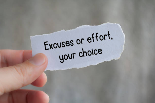 istock Excuses or effort, your choice text on torn paper with blur background 2106999517