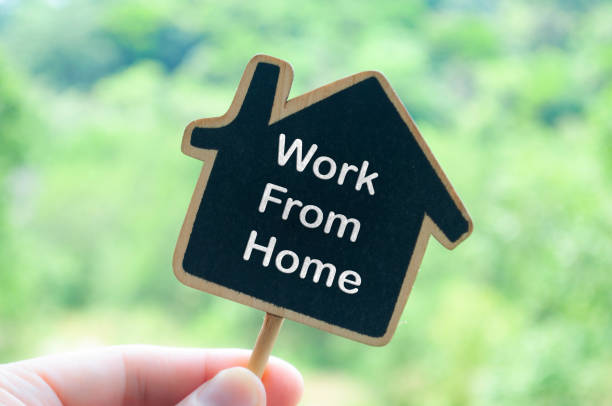 istock Work from home text on wooden house with nature background 2106999519