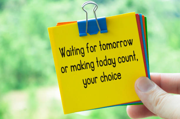istock Choice about tomorrow text on sticky notes with bright nature background 2106999522