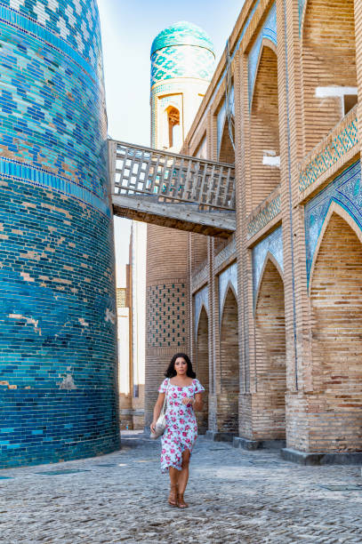 istock Khiva, a lady walking around the old city 2107008417