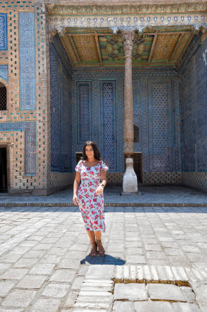 istock Khiva, a lady walking around the old city 2107011528