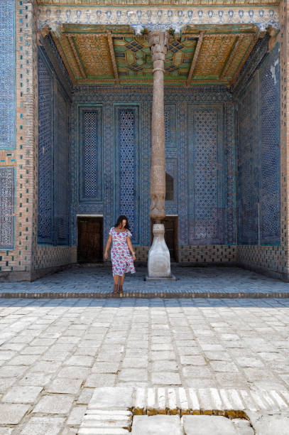 istock Khiva, a lady walking around the old city 2107012549