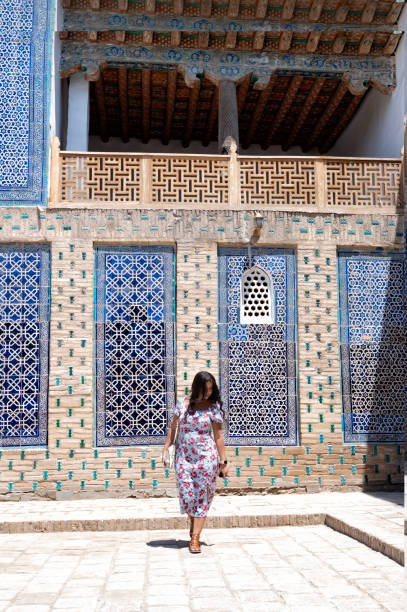 istock Khiva, a lady walking around the old city 2107014647