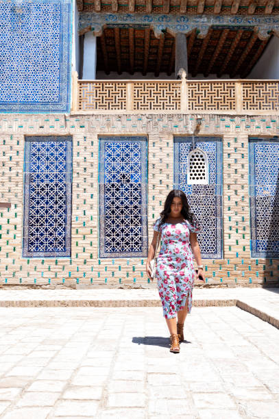 istock Khiva, a lady walking around the old city 2107016198