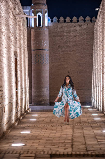 istock Khiva, a lady walking around the old city 2107018271