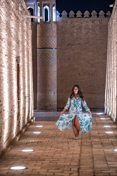 istock Khiva, a lady walking around the old city 2107019289