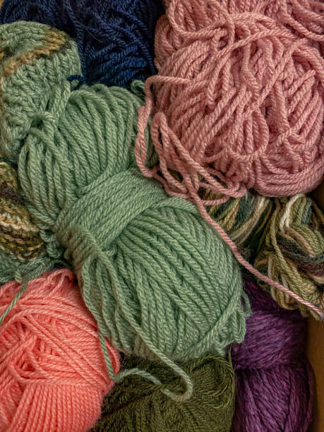 istock Multicolored skeins of yarn for knitting as a background. 2107058699