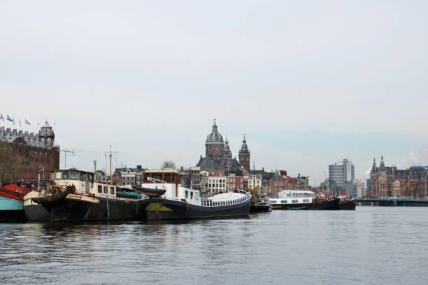 Amsterdam, Netherlands - April 12th 2018: The canals and cityscape of Amsterdam in early spring