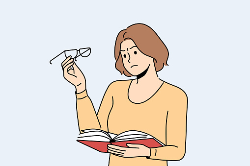 Woman experiences vision problems, reading book and looks at glasses with upset grimace. Girl with myopia or glocoma syndrome cannot see text in textbook and needs surgery to restore vision