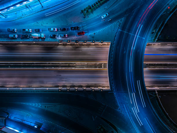 istock Expressway top view, Road traffic an important infrastructure, Drone aerial view fly in circle, traffic transportation, Public transport or commuter city life concept of economic and energ, transport. 2107090594