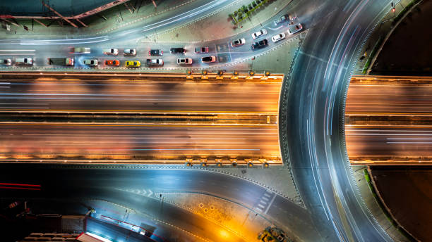 istock Expressway top view, Road traffic an important infrastructure, Drone aerial view fly in circle, traffic transportation, Public transport or commuter city life concept of economic and energ, transport. 2107091127