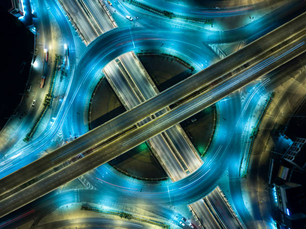 istock Expressway top view, Road traffic an important infrastructure, Drone aerial view fly in circle, traffic transportation, Public transport or commuter city life concept of economic and energ, transport. 2107091592