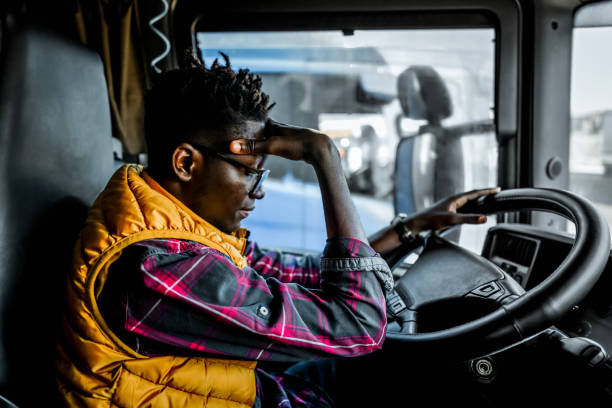 istock Tired truck driver having a headache after working extra hours 2107093741