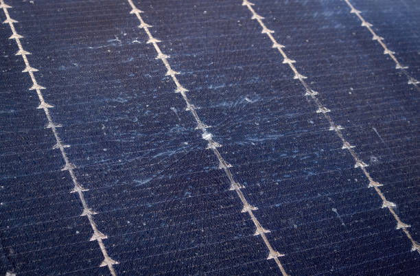 istock Close up view of damaged broken solar panel tempered glass cell. Stone dent in the middle with spiderweb cracks around. 2107097947