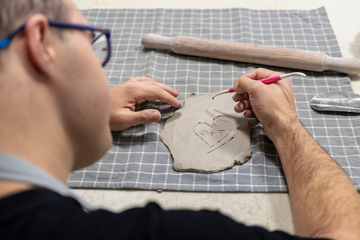 Young people with Down Syndrome at ceramics workshop