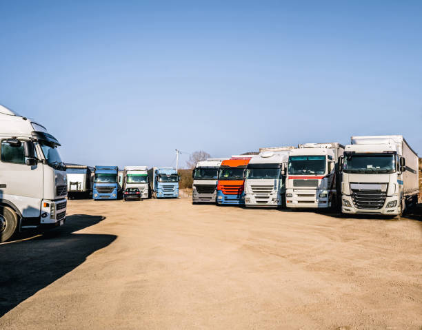 Row of trucks parked at a truck stop