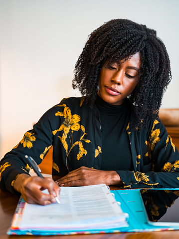 Finishing paperwork while working from a loft apartment in New York City