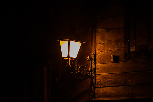 Old city lantern in street at night