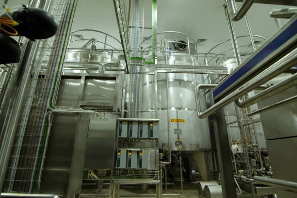 istock Equipment of winery. Large and small tanks for technological processes. 2107171215