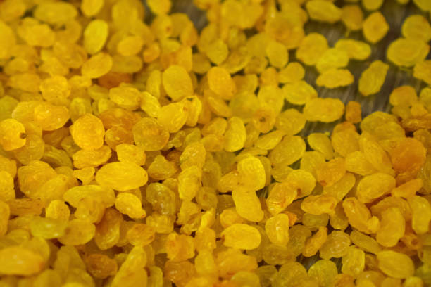 Yellow raisins, lots of dried grapes.