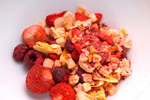 Freeze-dried fruits, strawberries, raspberries and others in a plate.
