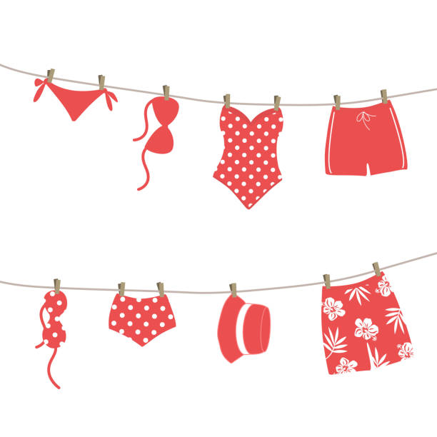 Red swimsuits and swimming trunks hanging on clotheslines Red swimsuits and swimming trunks hanging on clotheslines. Beautiful swim wear dry on clothespins after swimming. Summer vector illustration in red colors polka dot bathing suit stock illustrations