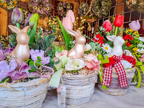 Happy Easter. Congratulatory easter background. Easter eggs, Bunnies and flowers. Traditional Easter Day Decorations in the Czech Republic. Background with space for copying. High quality photo
