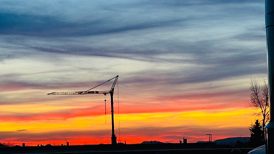 Dramatic sunset with crane