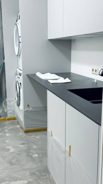 istock The new utility room, floor laying 2107281439
