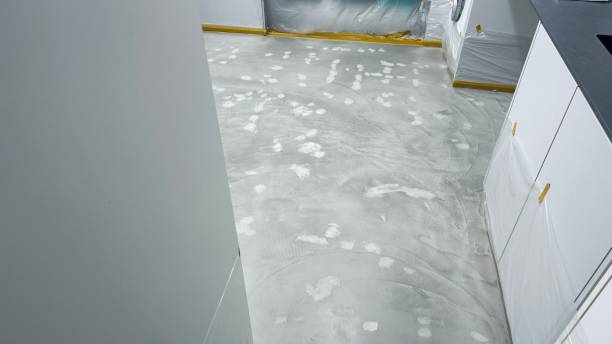 istock The new utility room, floor laying 2107281990