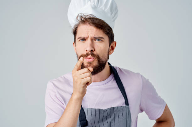 istock man in chef's uniform cooking food restaurant 2107357816