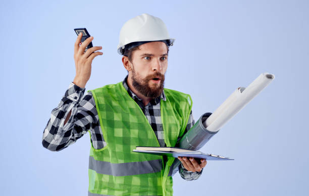 istock male engineer white helmet blueprints work safety professionals 2107359039