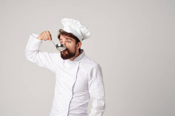 male chef tasting food kitchen job professional. High quality photo