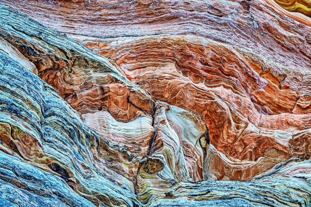 istock Sandstone is a clastic sedimentary rock composed mainly of sand-sized silicate grains. 2107385488