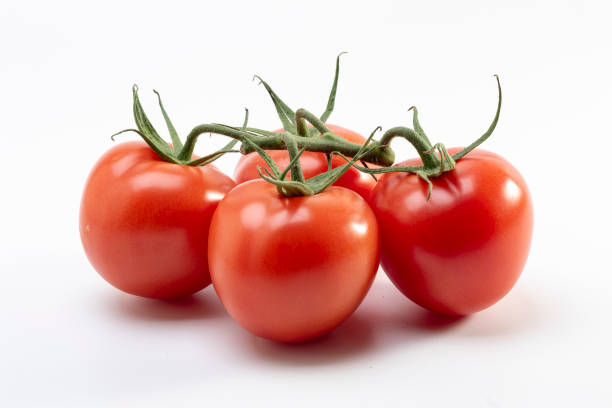 istock Tomatoes on isolated background fresh organic 2107392130