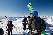 Ski mountaineers prepare to descend slope