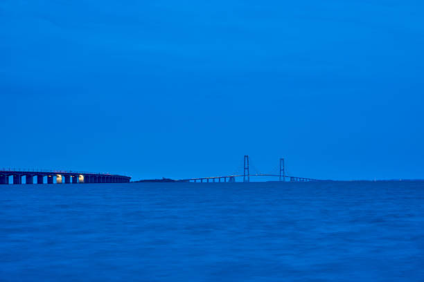great Storebelt suspension bridge connecting Denmarks islands across the baltic sea on a hazy sunny day.