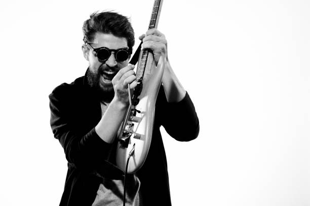 istock Man with guitar music performance entertainment contemporary performer sunglasses studio 2107445326