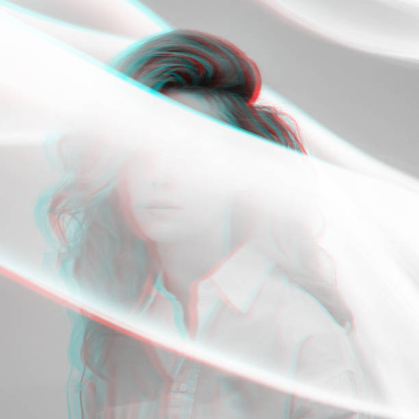 Abstract beautiful woman silhouette in bright light trails of light painting technique. Red and blue color split effect style. Long exposure photo. Image contains noise and motion blur