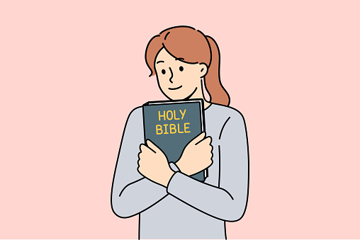 Believing woman embraces bible and feels enlightened after reading religious christian book with sermons or prayers. Holy bible in hands of teenage girl who wants to start study orthodoxy