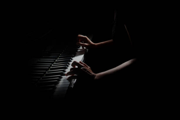 istock Piano player. Pianist hands playing grand piano 2107474891