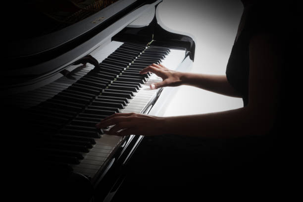 istock Piano player hands pianist playing keyboard. Grand piano keys 2107482766