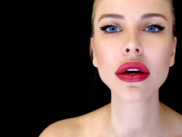 Woman with red lipstick on black background  Blue Eyes E
