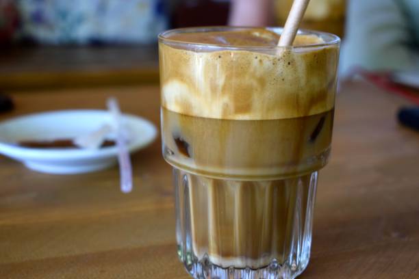 Fresh Greek freddo cappuccino iced coffee Delicious cold freddo cappuccino coffee at a greek cafe in summer freddo cappuccino stock pictures, royalty-free photos & images