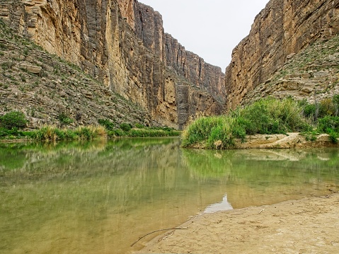 A view into Santa Elena canyon in Big Bend national park, The Rio Grande river separates the US from Mexico with Mexico on the left in this image.