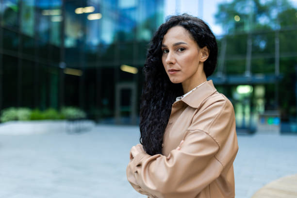 istock Confident professional woman standing in a business district 2107591942