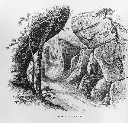 Illustration from Harper's Magazine Volume LXXIV -December 1886-May 1887 :-A Winding road through towering boulders in Rock City, Georgia