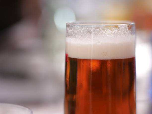 istock A glass of beer with foam. 2107653384