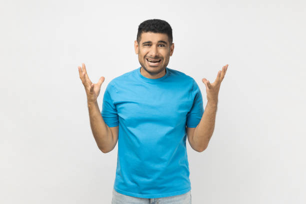 istock Angry frustrated man standing raised his arms, screaming with aggression, arguing with wife. 2107683948
