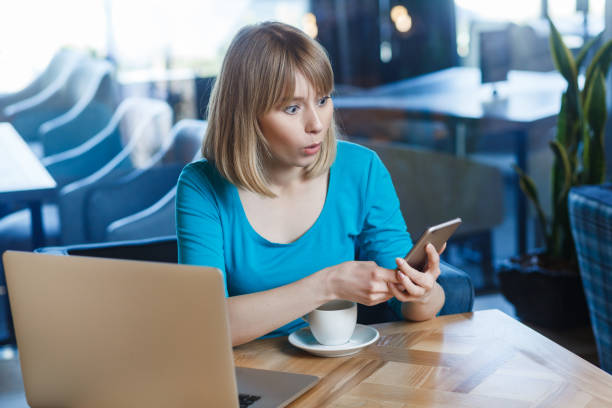 istock Shocked amazed woman working on laptop, having break, checking social networks reading breaking news 2107702694